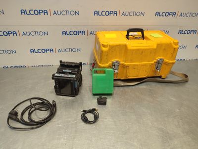 an image of a yellow box with wires and a green machine
