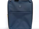an image of a blue suitcase on wheels against a white background