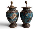 pair of asian vases with cranes on them on a white background