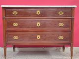 a wooden chest of drawers with marble top and brass handles