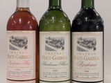 three bottles of wine sitting next to each other on a table