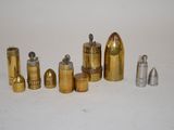 many different types of bullet shells on a white surface