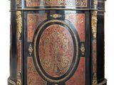 an image of a black and red cabinet with gold accents