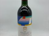 a bottle of wine that is sitting on a table