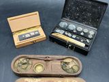 three different types of watches in a case on a table