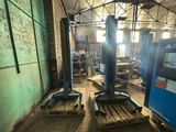 two machines that are sitting inside of a building