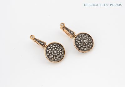 a pair of black and white diamond earrings on a white background