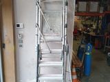 a ladder that is standing in a garage