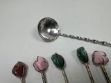 five spoons that are sitting next to each other