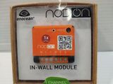 an orange in - wall module in a cardboard box with a qr code on it