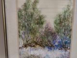 framed watercolor painting of a winter scene with trees in the snow