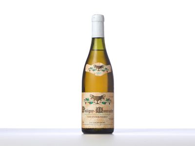 a bottle of white wine sitting on top of a table