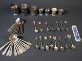 many spoons and silverware on the table