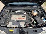 a car engine with the hood open on the street