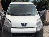 a white van that is parked in the dirt