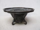 a black bowl that is sitting on top of a table
