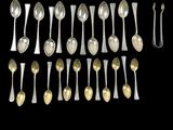 a lot of spoons and spoon spoons on a black background
