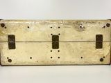 an old suitcase that is sitting on a table