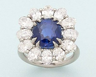 an oval sapphire and diamond cluster ring