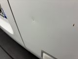 a close up of a car door with a sticker on it
