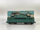 an image of a green train car with a crane on top of it