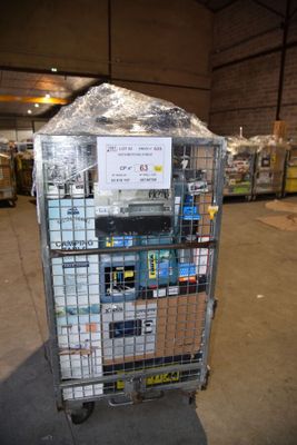 a metal cart with a sign on it in a warehouse