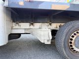 a close up of a flatbed truck with a flat tire
