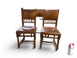 two chairs that are sitting next to each other