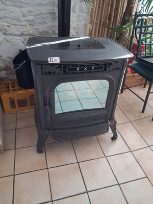 a stove sitting in the corner of a room