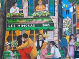 painting of a couple kissing in front of a cafe