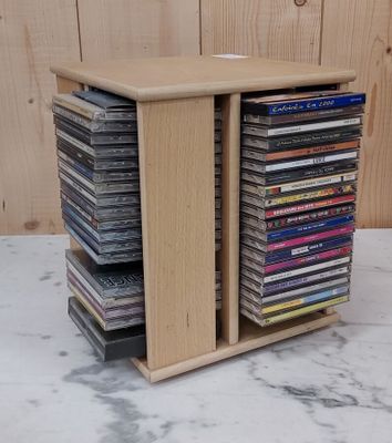 a stack of cds sitting on top of a table