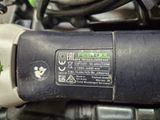 a close up of a motorcycle engine with a sticker on it