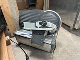 a machine that is sitting on the ground next to a box