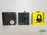 three boxes of gaming headsets sitting on a table next to each other