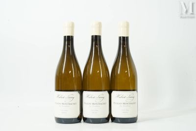 three bottles of wine sitting on top of a table next to each other