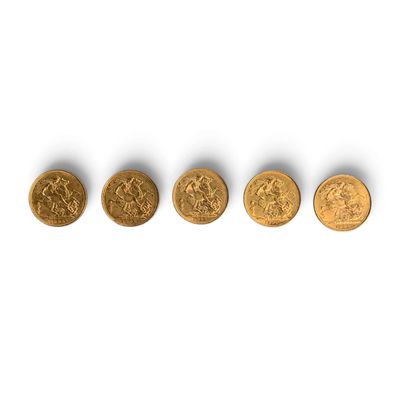 four gold coins are arranged in a row on a white surface