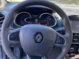 the interior of a car with a steering wheel and dashboard controls