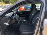 the interior of a car with the door open and the driver ' s seat up