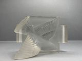 a glass sculpture of a bird that is sitting on a table