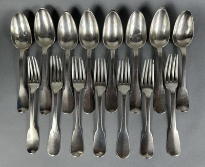 a lot of silver spoons and forks on a table