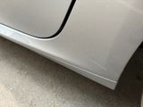 a close up of a car door with a sticker on it