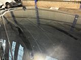 a reflection of a car in the windshield of a car
