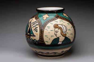 a vase with a picture of a woman on it