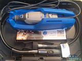 a blue tool in a box with wires and other items