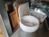 a bowl of water sitting on a counter in a kitchen