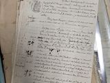 a pile of old papers sitting on top of a table