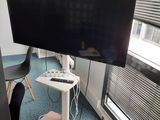a flat screen tv on a stand in a room