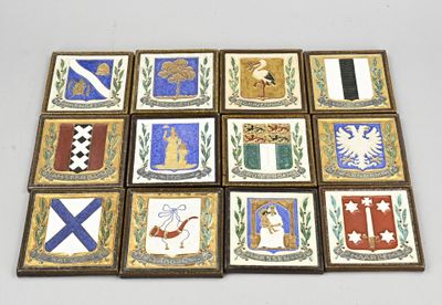 six square tiles with different designs on them on a white surface