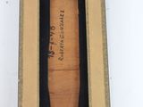 an image of a baseball bat in a wooden box on a white surface