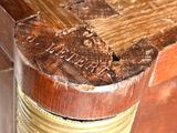 a close up of a wooden table with a clock on top of it